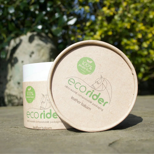 EcoRider EcoSoft Leather Balsam in its 100% plastic-free, zero-waste compostable cardboard packaging, set outdoors.