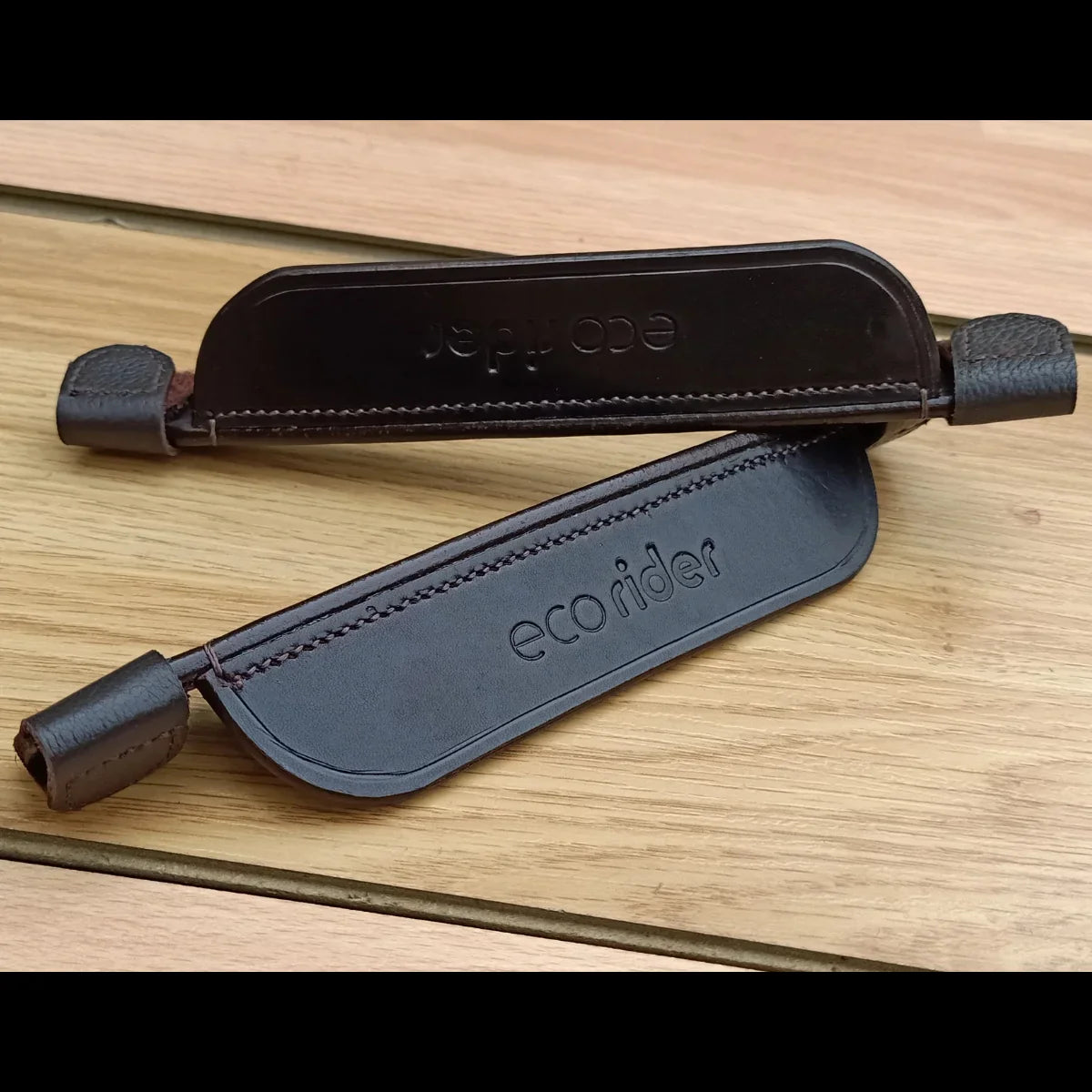 Brown EcoRider FEI Compliant Leather Blinkers separates pair featuring secure velcro cheekpiece attachments.